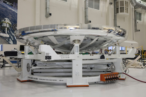 The heat shield for the Orion crew module has been secured in a special work stand at NASA's Kennedy Space Center.