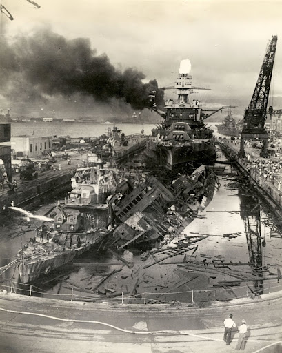 “Photo [of] the destroyer[s] USS Cassin and USS Downes in drydock with the battleship USS Pennsylvania in the background after the Japanese attack on Pearl Harbor, December 7, 1941,”
