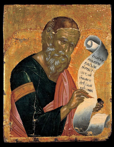 St John the Theologian writing his Revelations on an open scroll