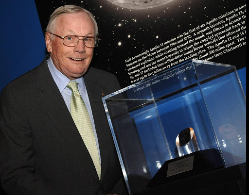 Neil Armstrong stands next to the NASA Ambassadors of Exploration award presented to him by NASA Administrator Michael Griffin.