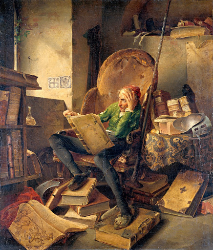 Don Quichotte, in an armchair reading