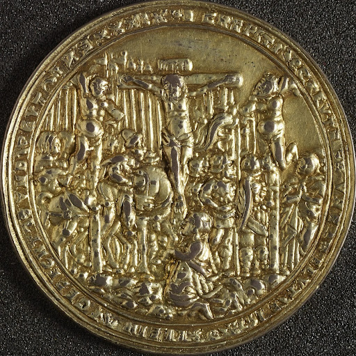Gilt medal, badly cast, showing crucifixion scenes