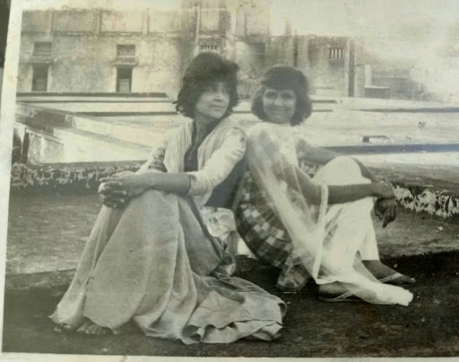 Sisters on the rooftop, the elder one in a gharara