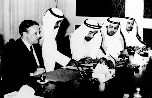 Sheikh Zayed Bin Sultan Al Nahyan signing the document of the termination of the Special Treaty Relations between the United Kingdom of Great Britain and Northern Ireland and the Emirate of Abu Dhabi