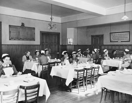 Photograph of nursing having their breakfast in the Florence Nightingale Nurses’ Home at the Royal Infirmary of Edinburgh