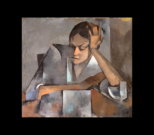 Mujer con los codos sobre la mesa