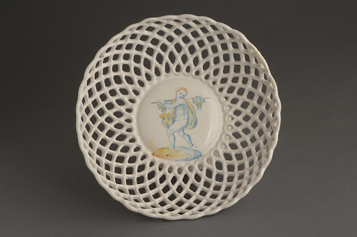 Bowl, perforated, with the figure of young fowler