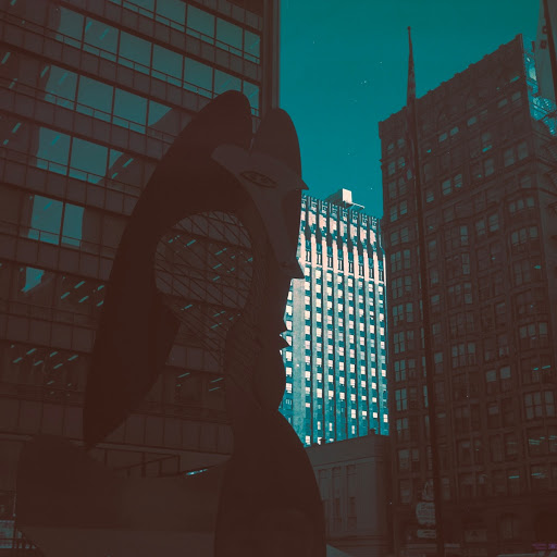 Chicago Picasso sculpture with Unity Building