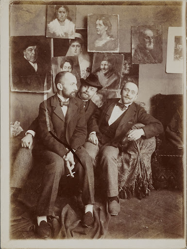 Three men in slippers in the studio, Dimitri Kardovski on the left