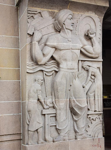 Detail view of bas-relief at the entrance, on the left, of New India Assurance
