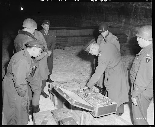 Generals Dwight D. Eisenhower and Omar N. Bradley examine German loot in a salt mine at Merkers.