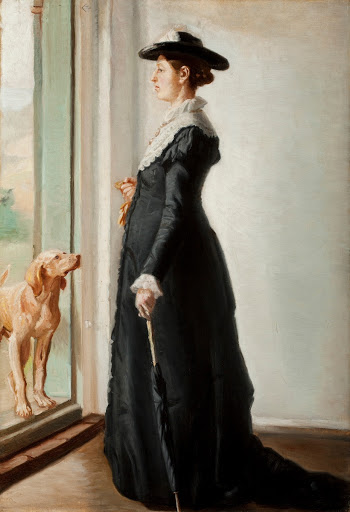 Anna Ancher stående i døren