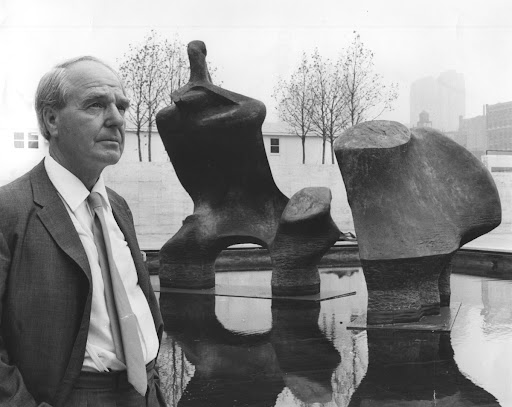 Henry Moore stands near his sculpture before dedication