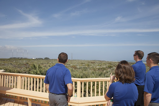 NASA astronaut candidates from left Josh Cassada Nicole Mann Tyler ``Nick'' Hague and Andrew Morgan look out on Kennedy Space Center.