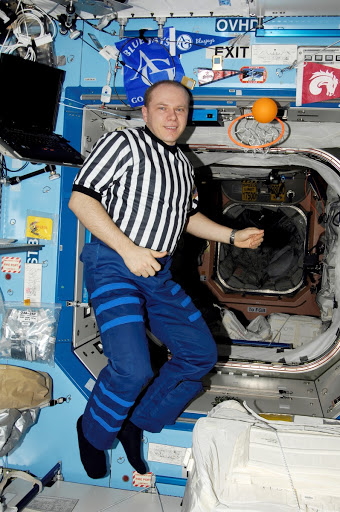 Kotov posing for a photo in the US Lab during Expedition 15