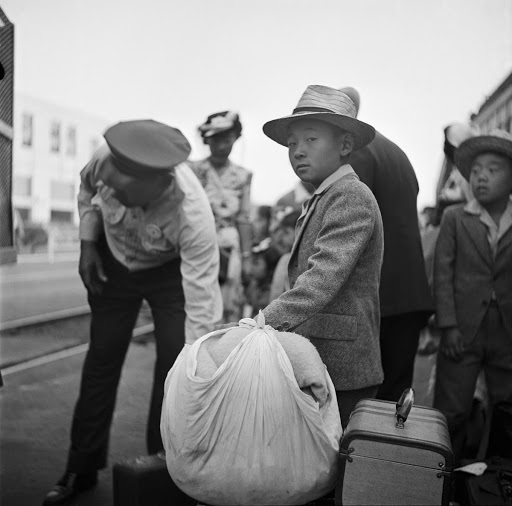 Children stand on a train platform in LA.
