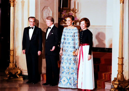 Carters entering State Dinner with Shah and Shahbanou of Iran