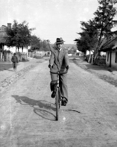 Siemnice. A young man riding a bicycle