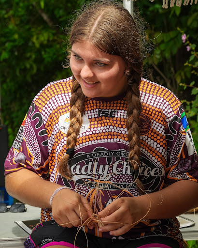A volunteer listening to the tree planting instructions