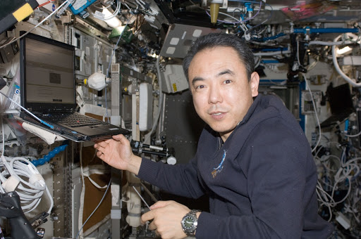 Japan Aerospace Exploration Agency astronaut Satoshi Furukawa is pictured near a computer in the Destiny laboratory of the International Space Station.