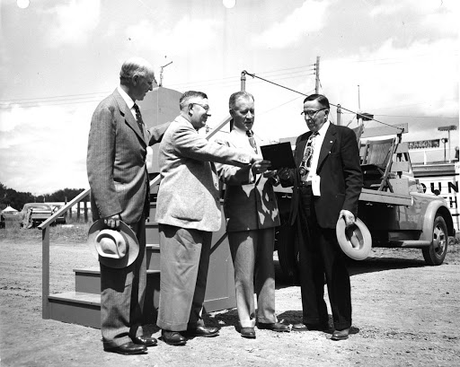 Cordiner, Trench, Male give 50 year pin to John Rogers at GE Quarter Century Club Outing at Altamont fair grounds