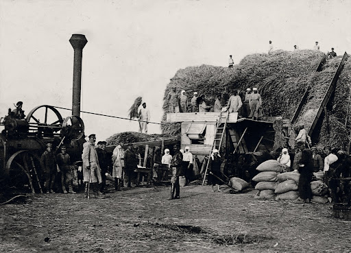 Artel Members near the Steam Threshing Machine