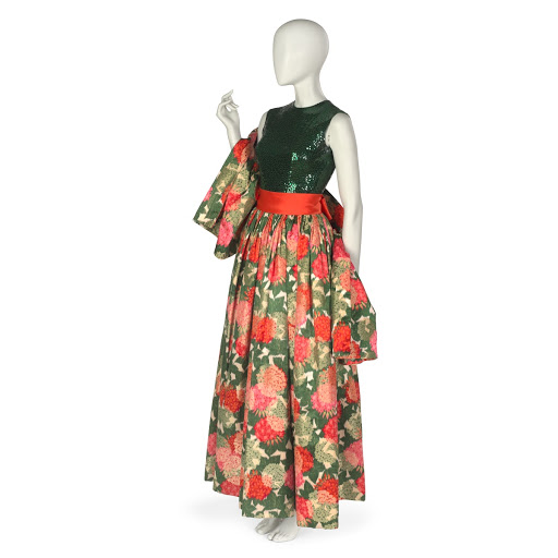 Evening ensemble comprising skirt, blouse, sash and stole in green, orange, red and pink warp-printed floral pattern