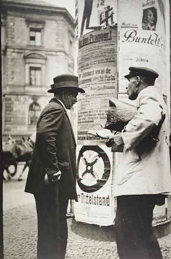 Conversation by an advertising column