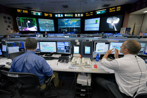 Expedition 43 flight control team with Flight Director Gary Horlacher during the release of SpaceX Dragon cargo vehicle. Photo Date: May 21, 2015. Location: Building 30 - FCR1. Photographer: Robert Markowitz