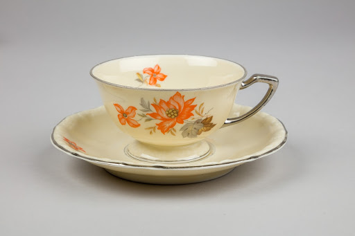 The white coffee cup with saucer.
