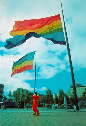 The two original eight-color rainbow flags flying at United Nations Plaza during San Francisco Gay Freedom Day 1978