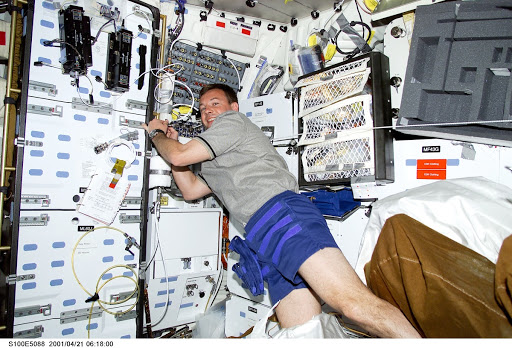 MS Lonchakov drifts by the galley on the middeck of Endeavour