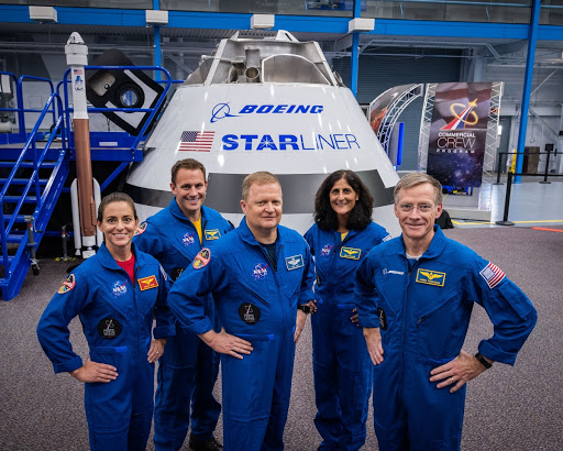 NASA astronauts from Nicole Mann Josh Cassada Eric Boe and Suni Williams pose with Boeing astronaut Chris Ferguson.
