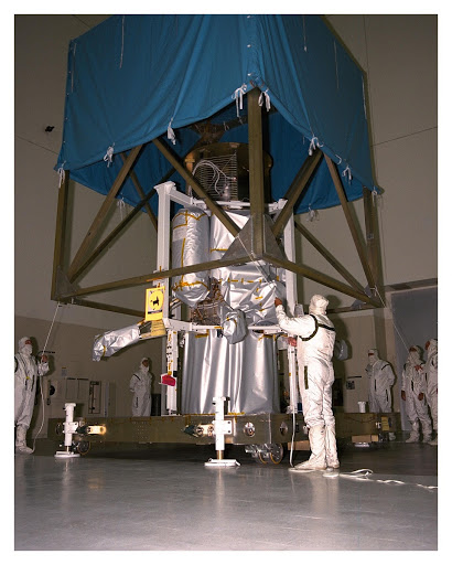 The cover on the Cassini Propulsion Module is installed and the module is moved to the Payload Hazardous Servicing Facility.