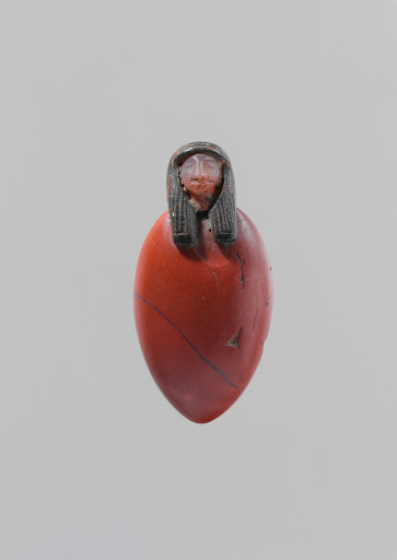 Heart amulet with human head