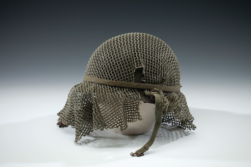 GI helmet with green netting