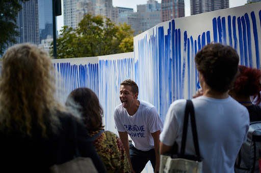 Artist Jeppe Hein teaching breathing exercises to participating school classes at Breathe with Me