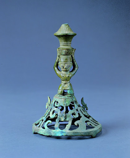 Kneeling man bearing a zun