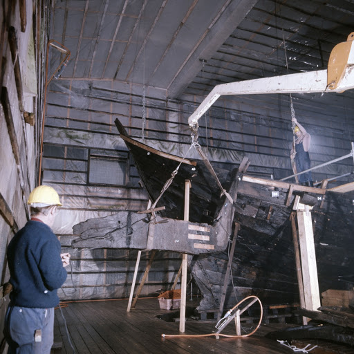 The cog is erected with the aid of a crane, circa 1975