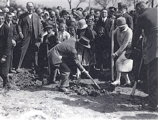 Guests of T. G. Masaryk performing the ceremonial digging foundation of Exemplary social building of Czechoslovak Red Cross – Counselling centre for mothers with children