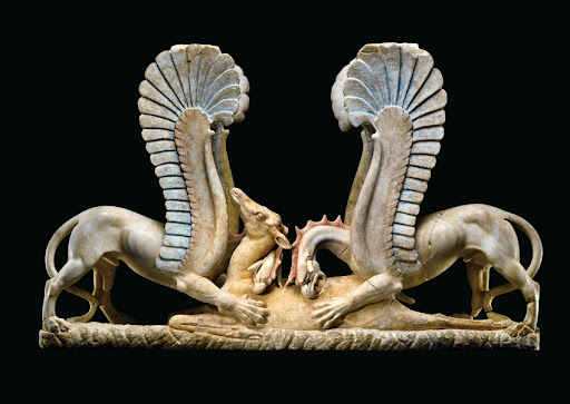 Two Griffins eating a doe