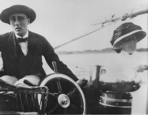 Roosevelt at the wheel with his mother Sara while sailing around Campobello Island