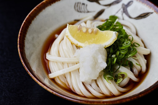 Bukkake-Udon (Udon Noodles in a soup with Various Ingredients and Condiments)