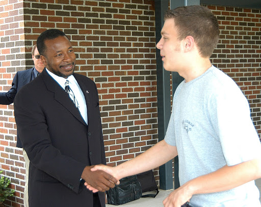 Woodrow Whitlow KSC deputy director greets a student outside Trojan Intermediate School in Potosi Mo.