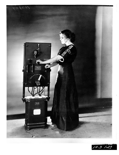 Woman operating General Electric Car Charger