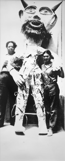 Frida's father, Guillermo Kahlo, was a photographer. When the couple returned temporarily to Mexico, he photographed them at the Blue House with a "Judas" effigy made by Carmen Caballero, a papier-mâché artist and Rivera's "personal Judas maker."