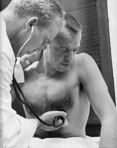 Astronaut Alan B. Shepard has his blood pressure and temperature checked