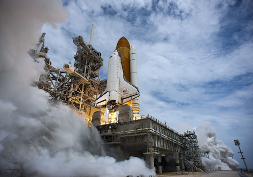 Atlantis' engines ignite as it lifts off out of billows of smoke and steam on its STS-135 mission to the International Space Station.