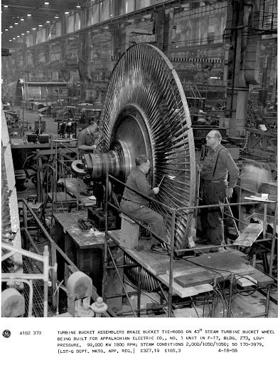 Turbine bucket assemblers braze bucket tie-rods on 43" steam turbine bucket wheel being built for Appalachian Electric Co., No. 1 unit in F-17, Bldg. 273, low-pressure. 99,000 KW 1800 RPM; steam conditions 2,000/1050/1050; SO 170-3979. (Lst-G Department Mktg. App. Req.)
