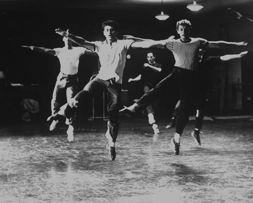 Unidentified male chorus members dancing during rehearsals for musical "West Side Story".